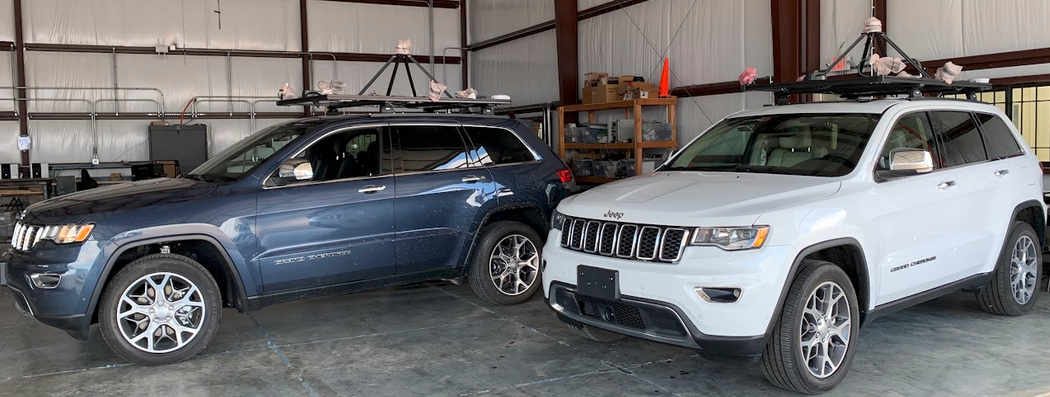 Two AVA research vehicles equipped with rooftop sensors